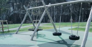 Playground with swings - Underground made with Rubber coloured granulate